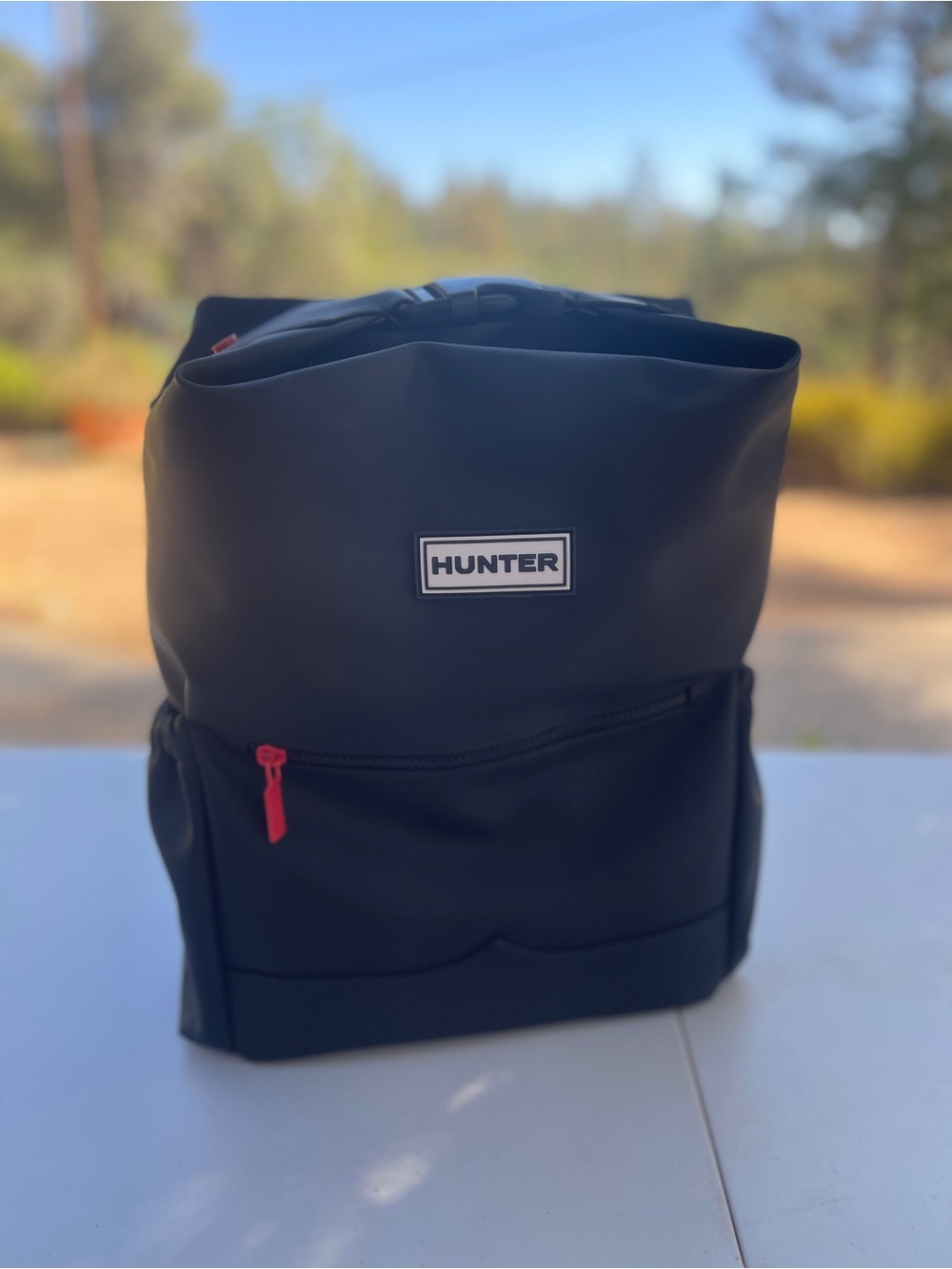 Hunter Black Roll-Top Backpack with Red Zip Pull